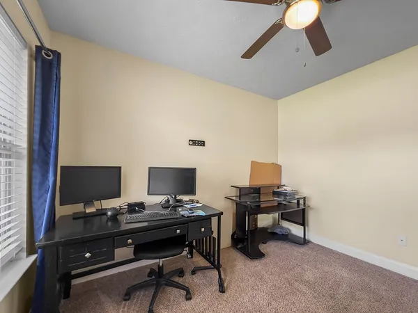 a view of a workspace with furniture