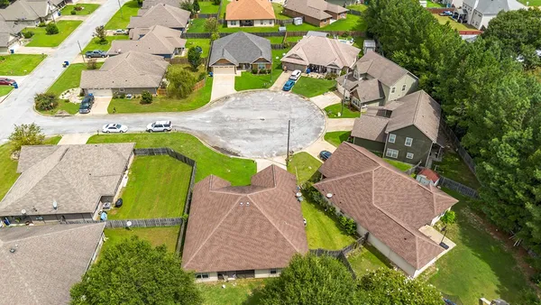 an aerial view of residential house with outdoor space