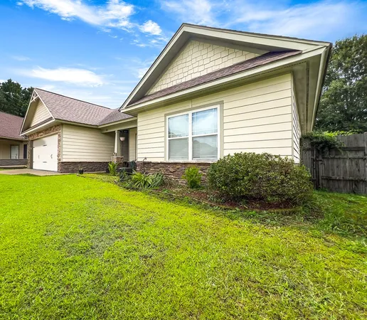 a house view with a garden space