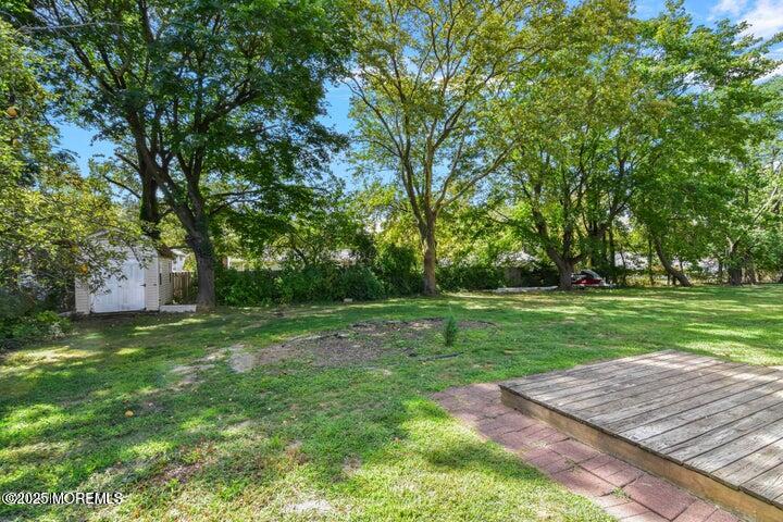 7 Kaylen Place Hazlet, NJ 07730 - Photo 14 of 22 a view of a backyard with large trees