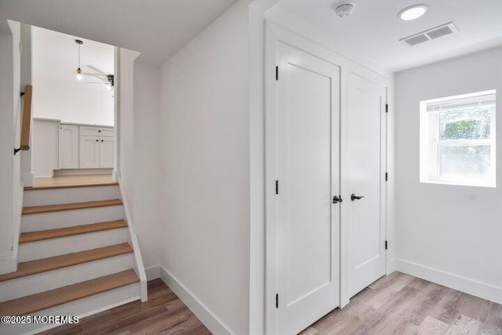 7 Kaylen Place Hazlet, NJ 07730 - Photo 17 of 22 a view of a hallway with wooden floor and entryway