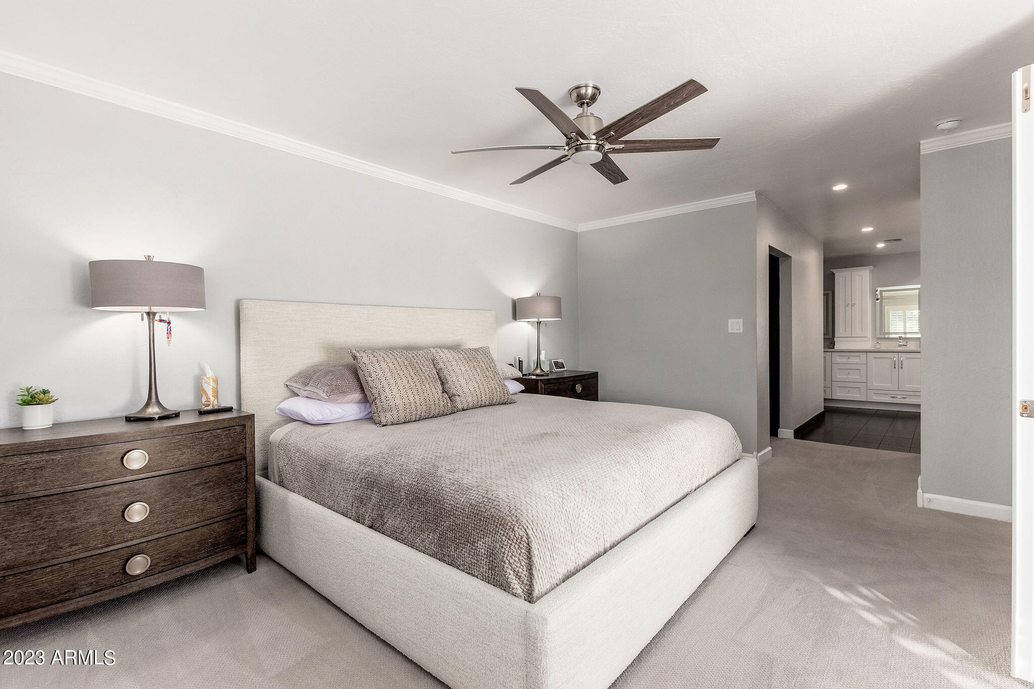 5822 North Scottsdale Road Paradise Valley, AZ 85253 - Photo 11 of 31 a bedroom with a bed and a chandelier