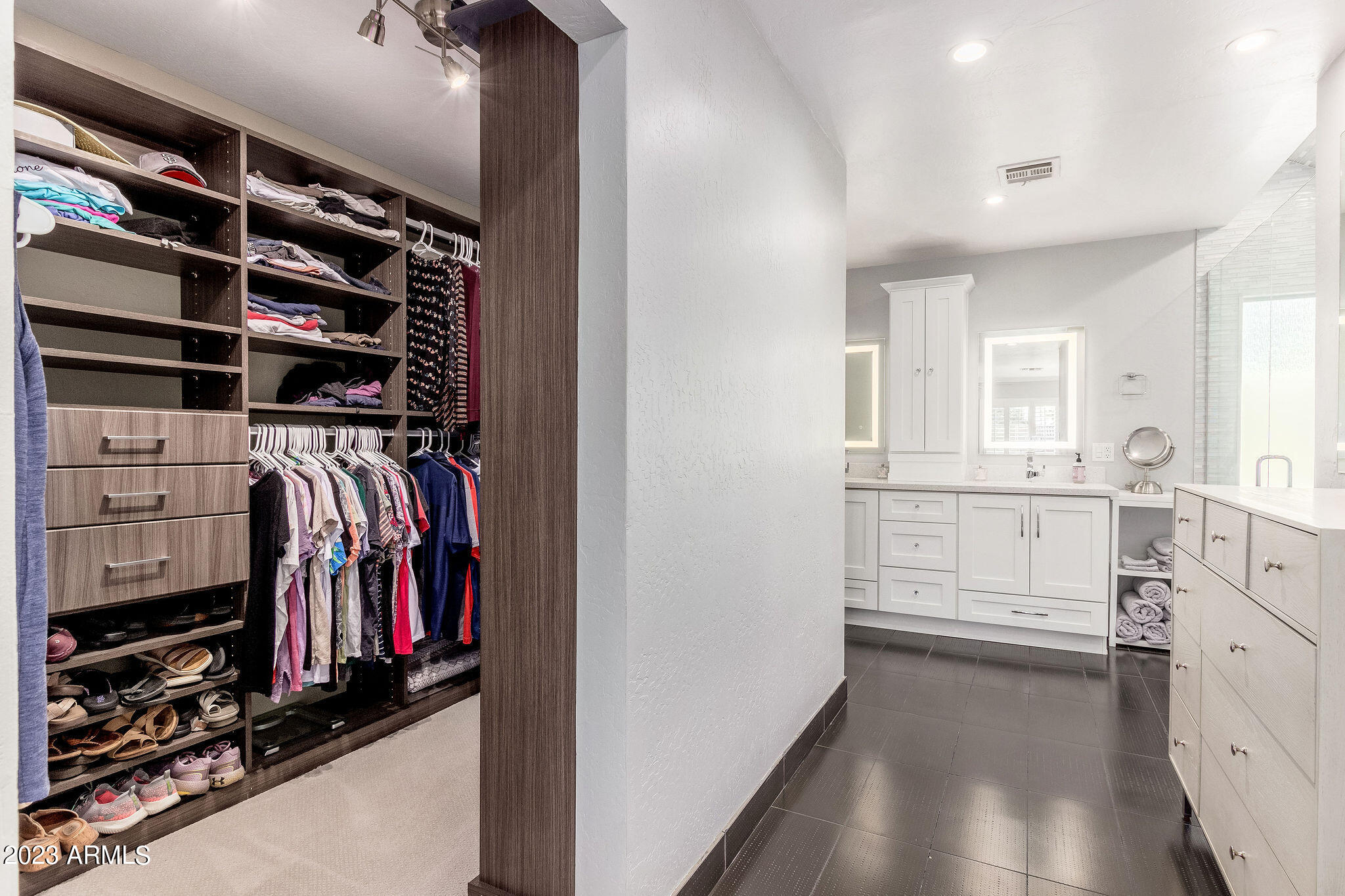 5822 North Scottsdale Road Paradise Valley, AZ 85253 - Photo 12 of 31 a view of walk in closet with clothes and shoes