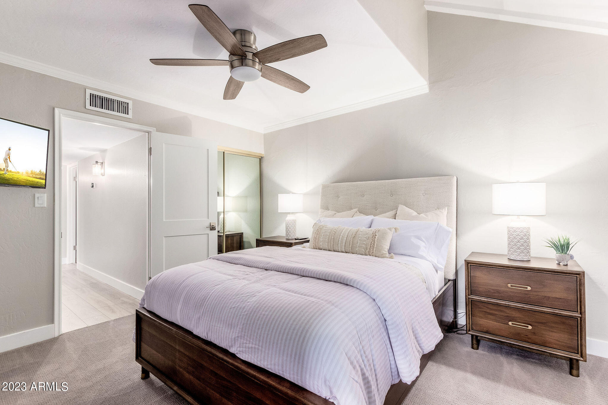 5822 North Scottsdale Road Paradise Valley, AZ 85253 - Photo 16 of 31 a bedroom with a bed and a cabinets