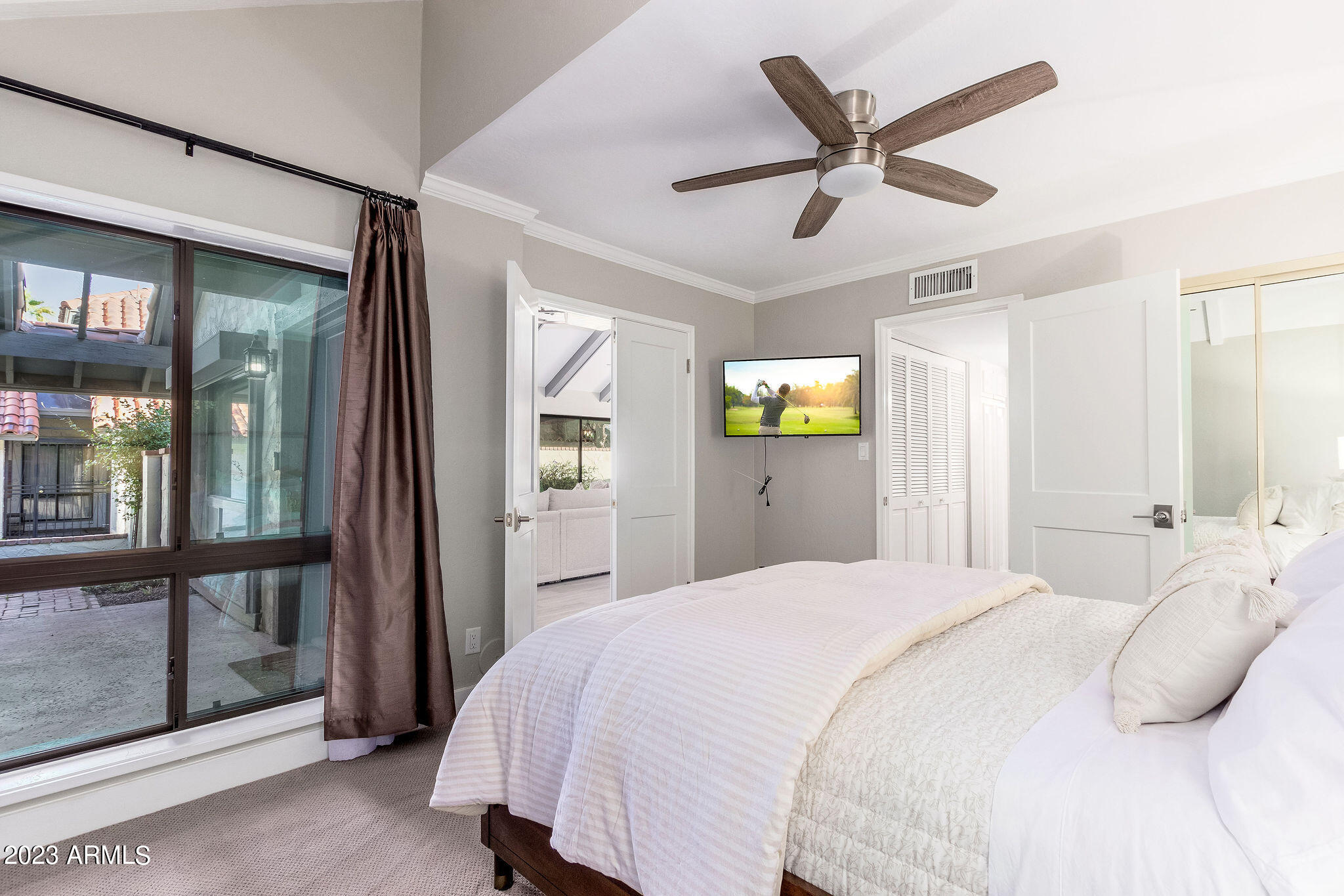 5822 North Scottsdale Road Paradise Valley, AZ 85253 - Photo 17 of 31 a bedroom with a bed and window