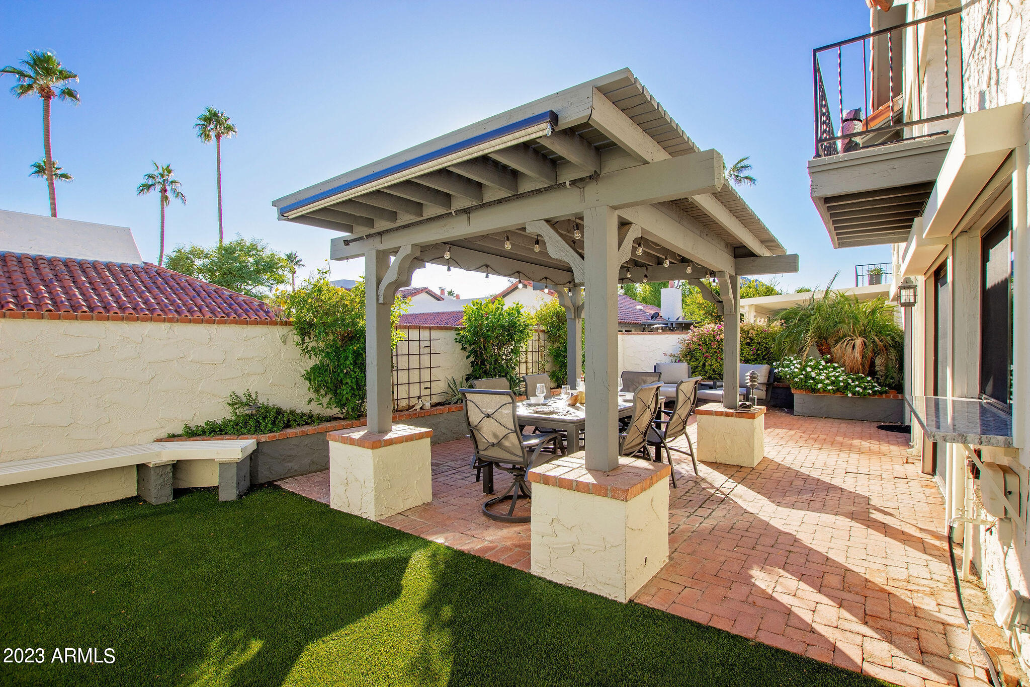 5822 North Scottsdale Road Paradise Valley, AZ 85253 - Photo 20 of 31 a view of a patio with table and chairs potted plants