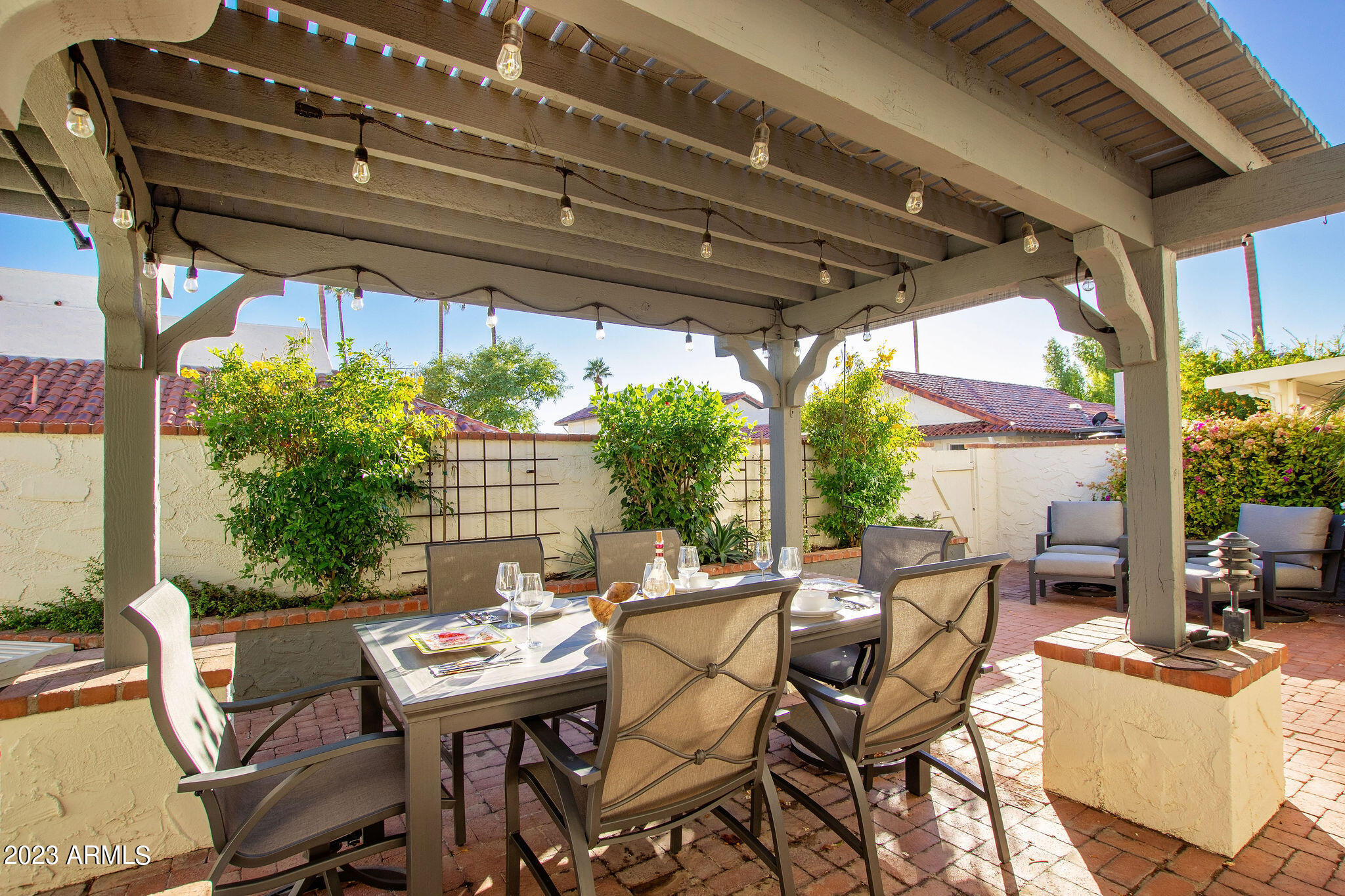 5822 North Scottsdale Road Paradise Valley, AZ 85253 - Photo 24 of 31 a view of patio with table and chairs and potted plants