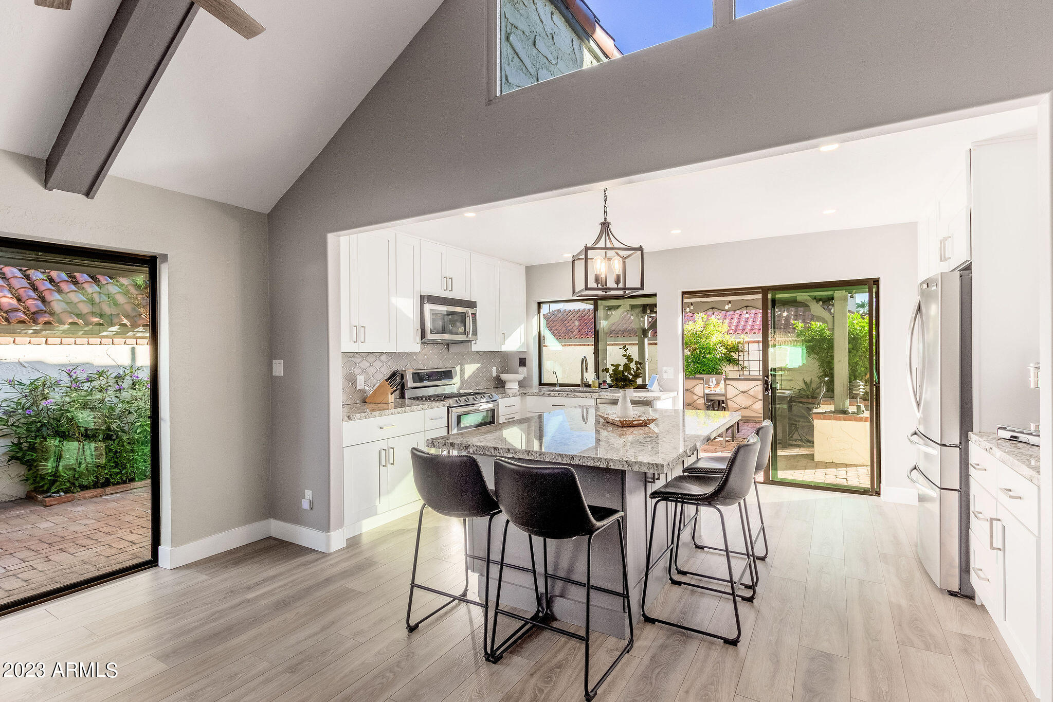 5822 North Scottsdale Road Paradise Valley, AZ 85253 - Photo 6 of 31 a view of a dining room with furniture window and wooden floor