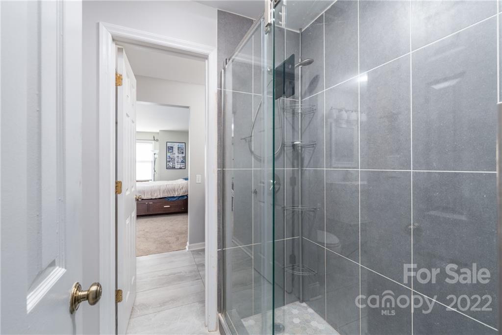 318 Queens Road, Unit 2 Charlotte, NC 28204 - Photo 12 of 18 a en suite bathroom with a shower
