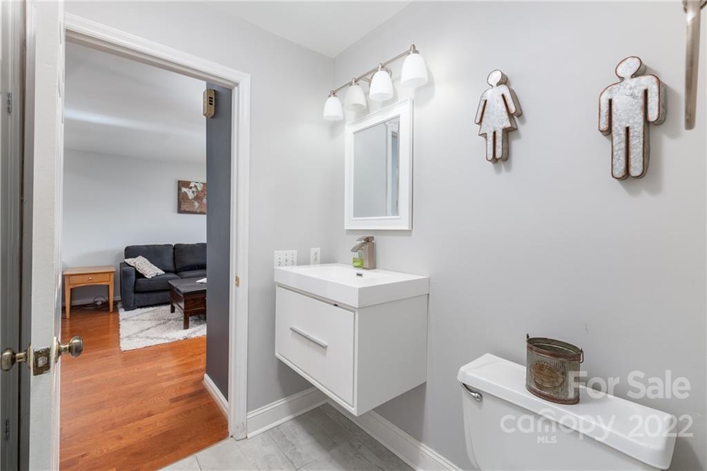 318 Queens Road, Unit 2 Charlotte, NC 28204 - Photo 13 of 18 a bathroom with a sink and a mirror