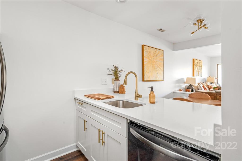 318 Queens Road, Unit 2 Charlotte, NC 28204 - Photo 17 of 18 a kitchen with a sink and a stove top oven