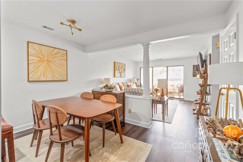 318 Queens Road, Unit 2 Charlotte, NC 28204 - Photo 2 of 18 a view of a dining room with furniture and wooden floor