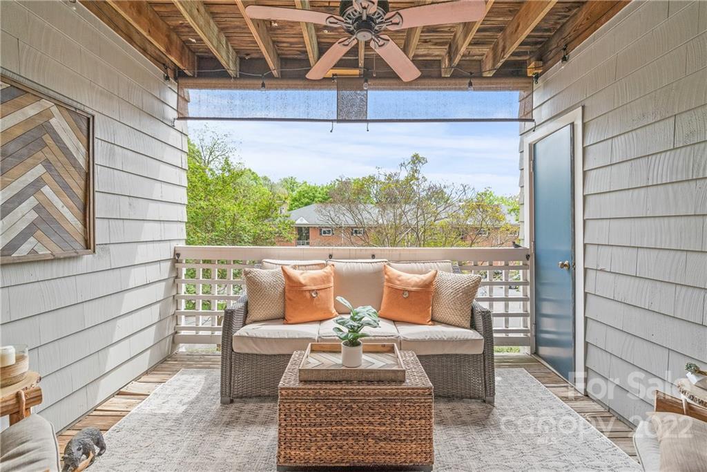 318 Queens Road, Unit 2 Charlotte, NC 28204 - Photo 3 of 18 a outdoor sitting area with furniture and wooden floor