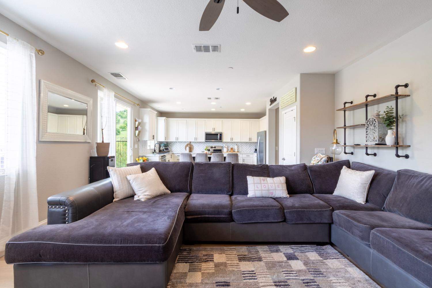 9419 Vintner Circle Patterson, CA 95363 - Photo 15 of 34 a living room with furniture and a large window