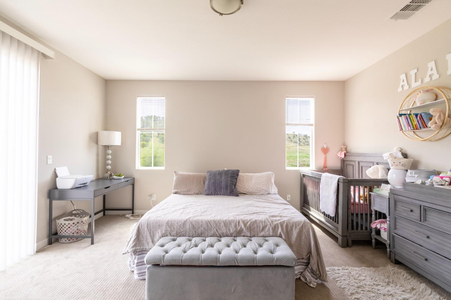 9419 Vintner Circle Patterson, CA 95363 - Photo 19 of 34 a bedroom with a bed and a window