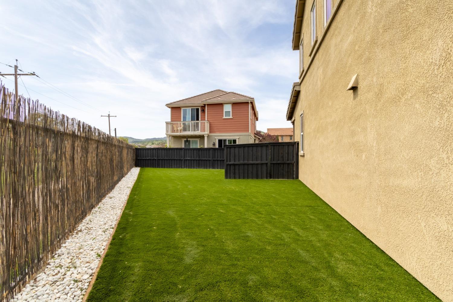 9419 Vintner Circle Patterson, CA 95363 - Photo 33 of 34 a view of a backyard with a garden