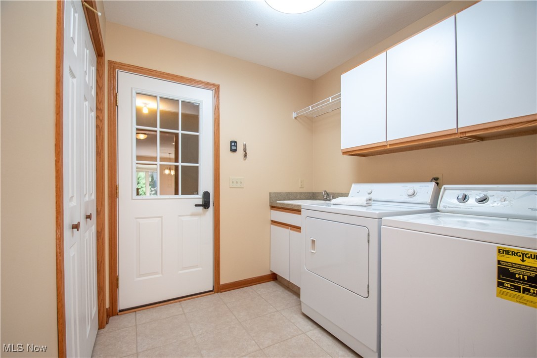 7007 Clingan Road, Unit 64 Youngstown, OH 44514 - Photo 32 of 50 Pocket door to close off laundry area. Exit to garage.