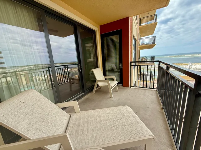 a view of balcony with furniture