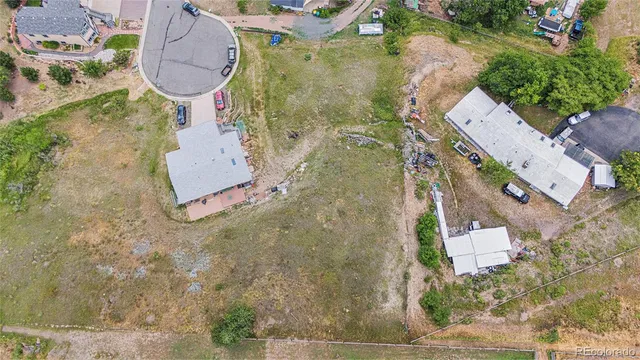 an aerial view of a house with swimming pool