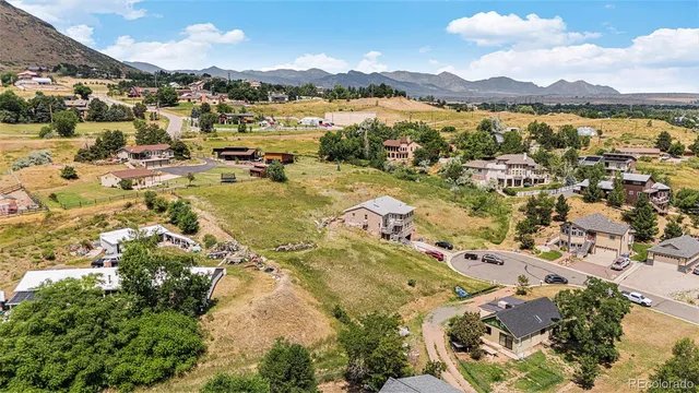 an aerial view of residential building and lake