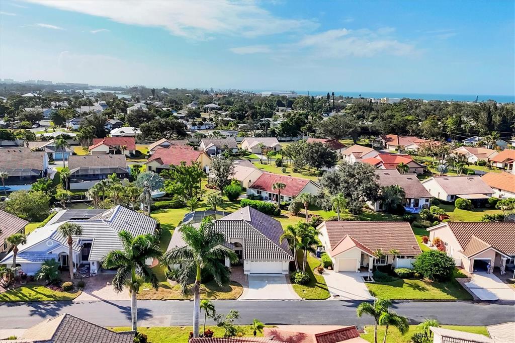 an aerial view of a houses with a swimming pool