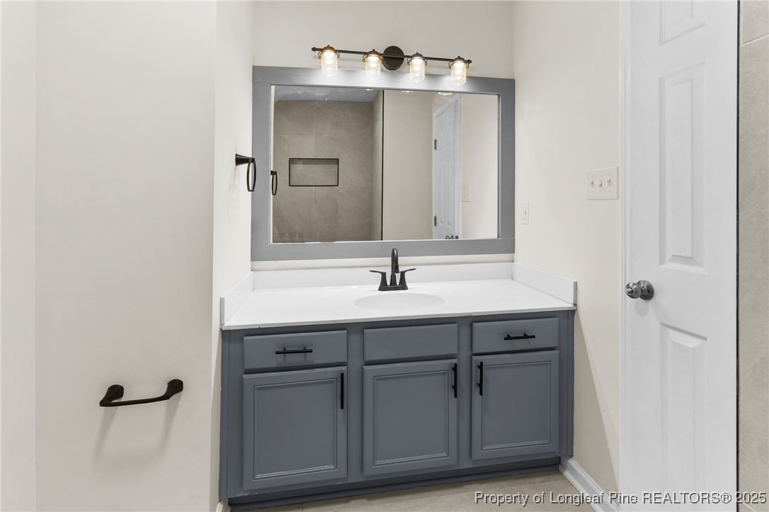 5520 Rising Ridge Drive Hope Mills, NC 28348 - Photo 18 of 30 a sink with a mirror