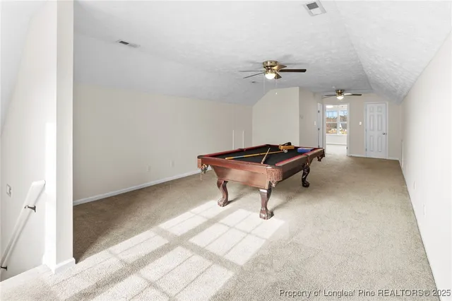 a bathroom with a toilet sink vanity shower and mirror