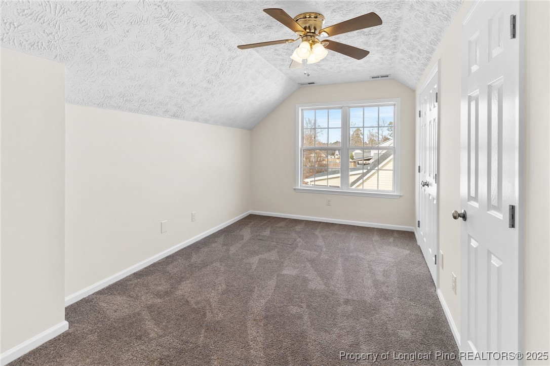 5520 Rising Ridge Drive Hope Mills, NC 28348 - Photo 23 of 30 an empty room with windows and fan