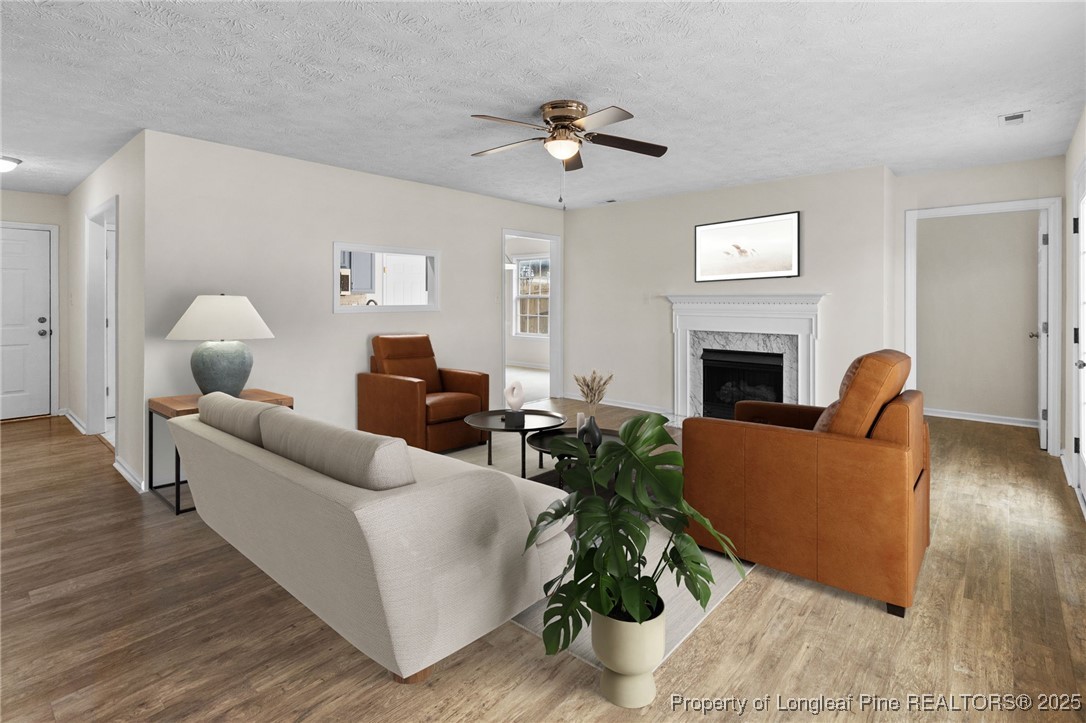 5520 Rising Ridge Drive Hope Mills, NC 28348 - Photo 5 of 30 a living room with furniture and a fireplace