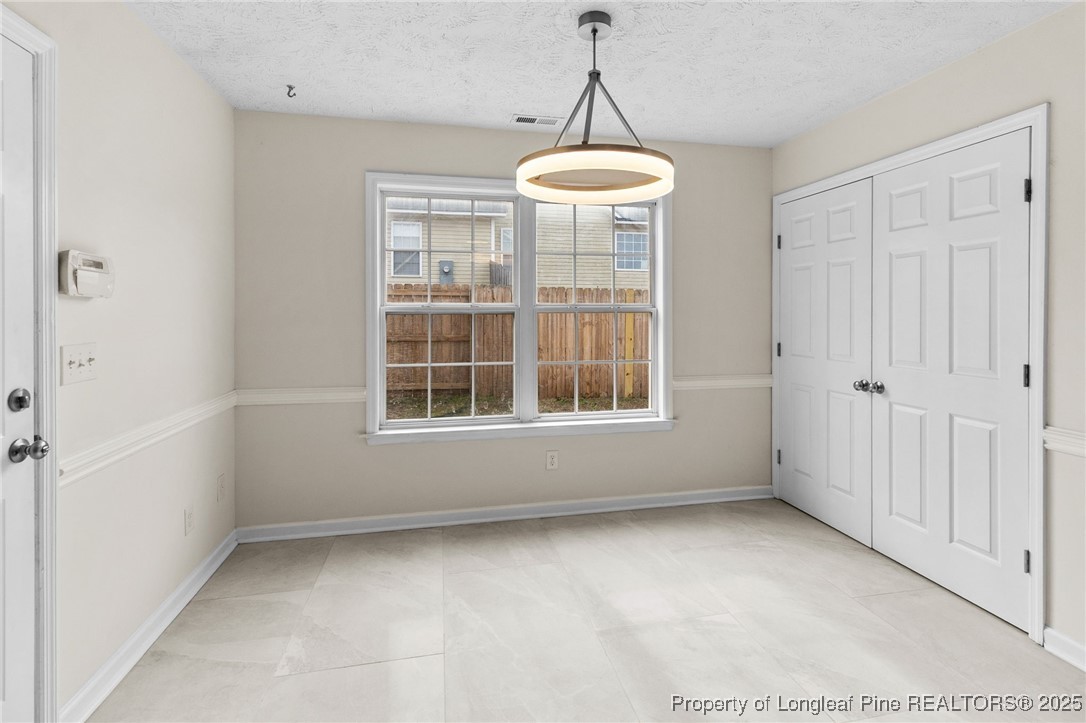 5520 Rising Ridge Drive Hope Mills, NC 28348 - Photo 8 of 30 a view of an empty room with a window