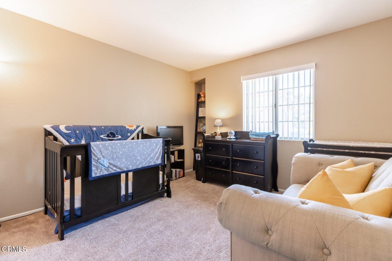 5204 Columbus Place Oxnard, CA 93033 - Photo 6 of 9 a view of a livingroom with furniture and window