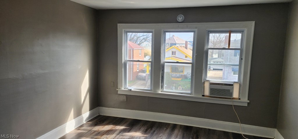 1514 Clermont Road Cleveland, OH 44110 - Photo 10 of 16 Unfurnished room with dark wood-style flooring and cooling unit