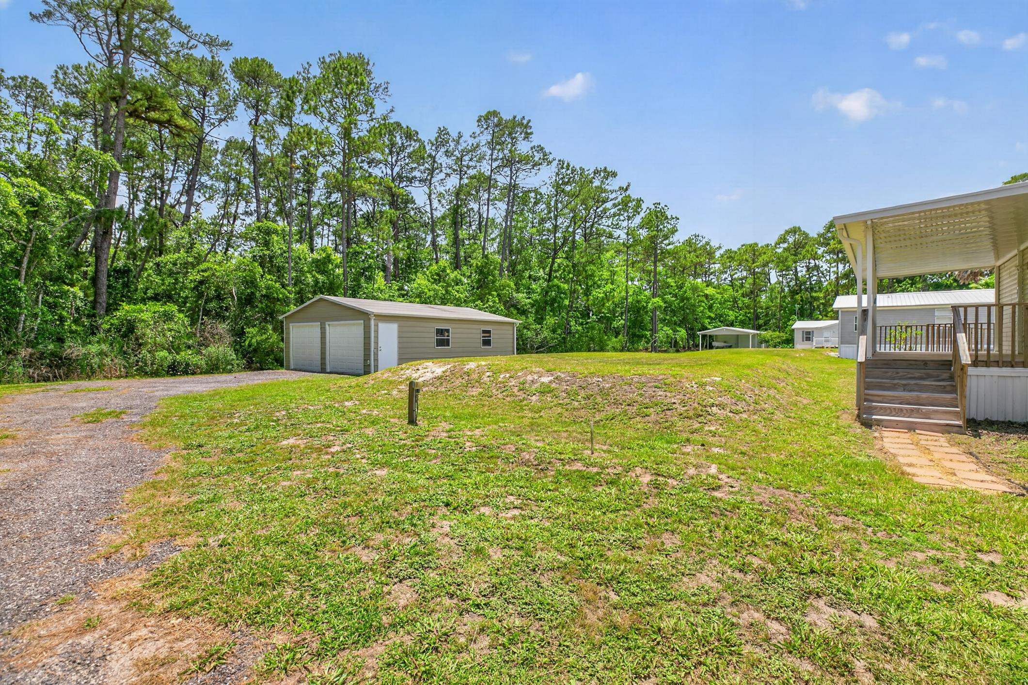 101 Trout Trail Crescent City, FL 32112 - Photo 23 of 45 a view of a yard with a tree