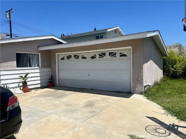 a front view of a house with a garage