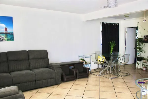 a living room with furniture and white walls