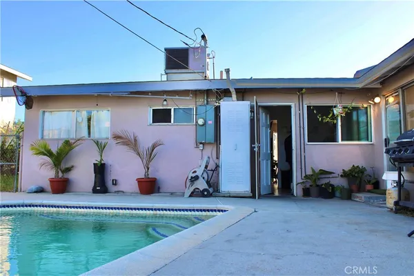 a view of a house with chair and a table