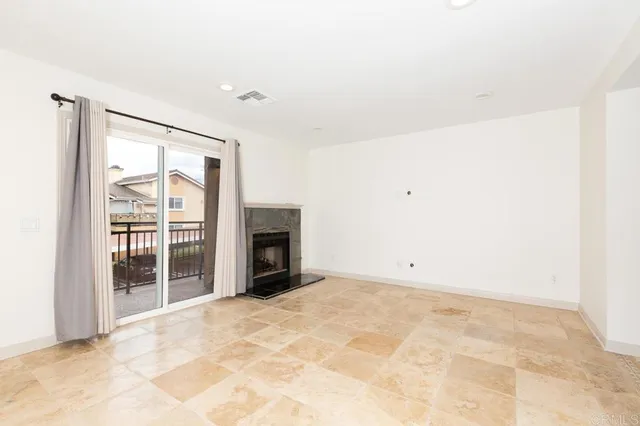 an empty room with fireplace