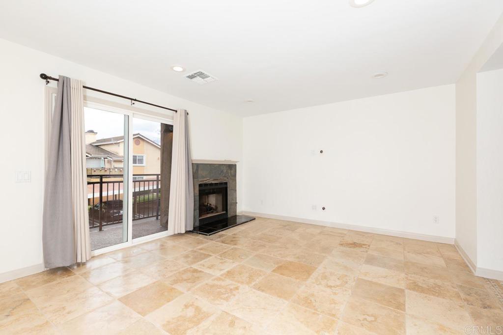 an empty room with fireplace