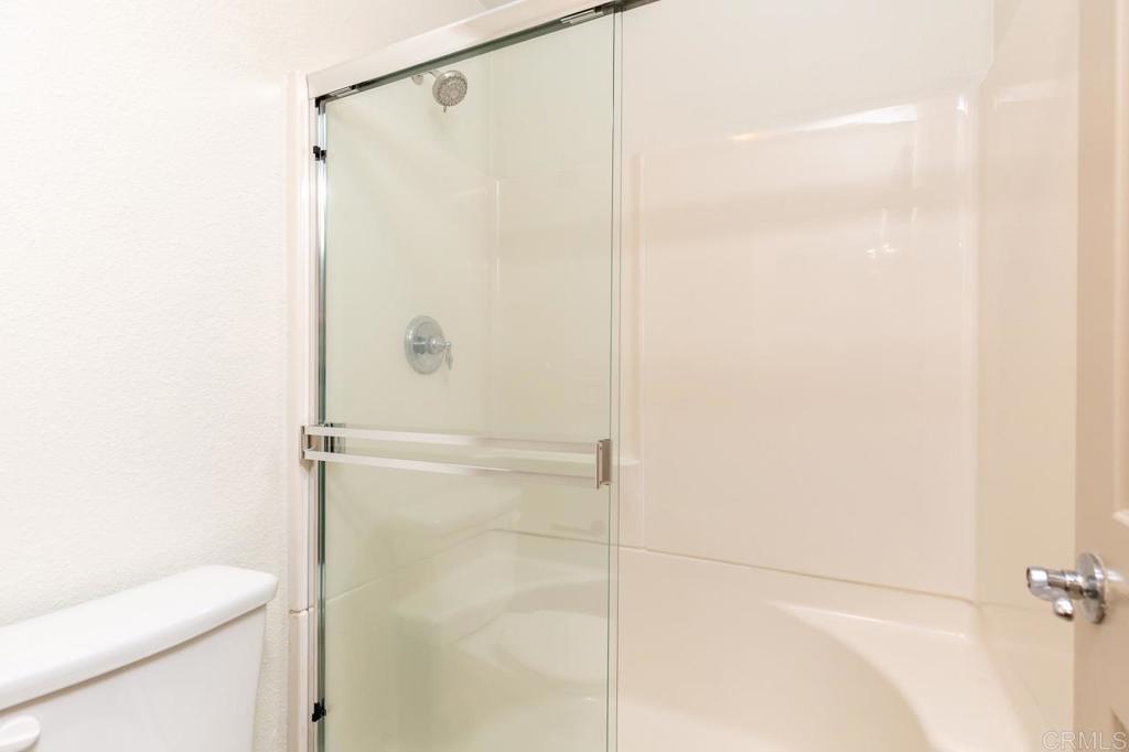 505 San Pasqual Valley Road, Unit 186 Escondido, CA 92025 - Photo 12 of 28 a bathroom with a shower and a toilet