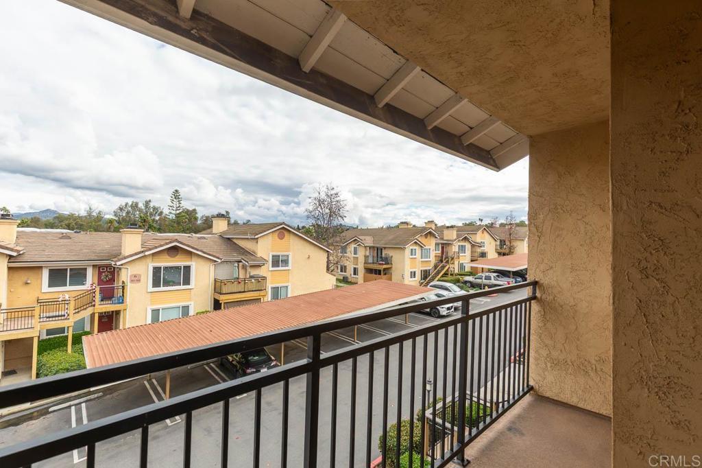 505 San Pasqual Valley Road, Unit 186 Escondido, CA 92025 - Photo 14 of 28 a view of a building from a balcony