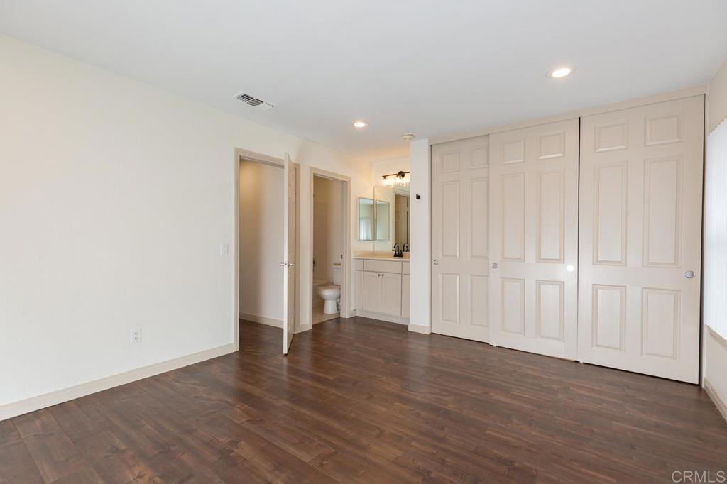 505 San Pasqual Valley Road, Unit 186 Escondido, CA 92025 - Photo 16 of 28 a view of an empty room with wooden floor