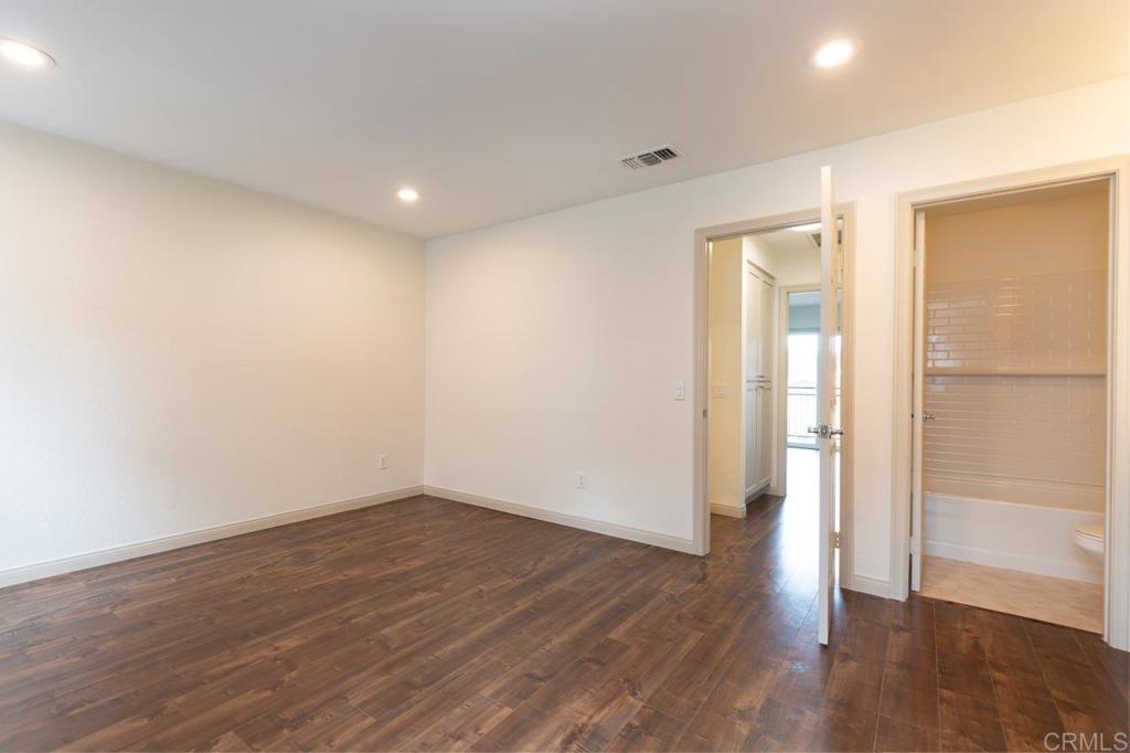 505 San Pasqual Valley Road, Unit 186 Escondido, CA 92025 - Photo 18 of 28 a view of empty room with wooden floor