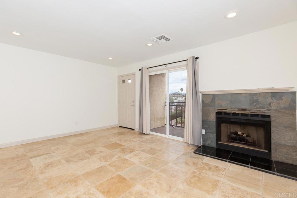505 San Pasqual Valley Road, Unit 186 Escondido, CA 92025 - Photo 2 of 28 an empty room with a fireplace