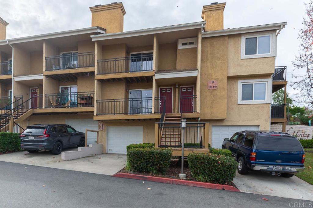 505 San Pasqual Valley Road, Unit 186 Escondido, CA 92025 - Photo 25 of 28 a car parked in front of a house