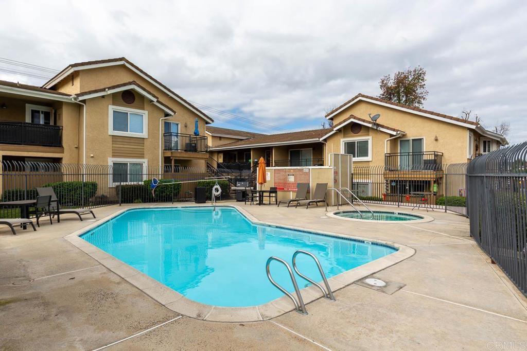 505 San Pasqual Valley Road, Unit 186 Escondido, CA 92025 - Photo 28 of 28 a view of a house with pool and chairs