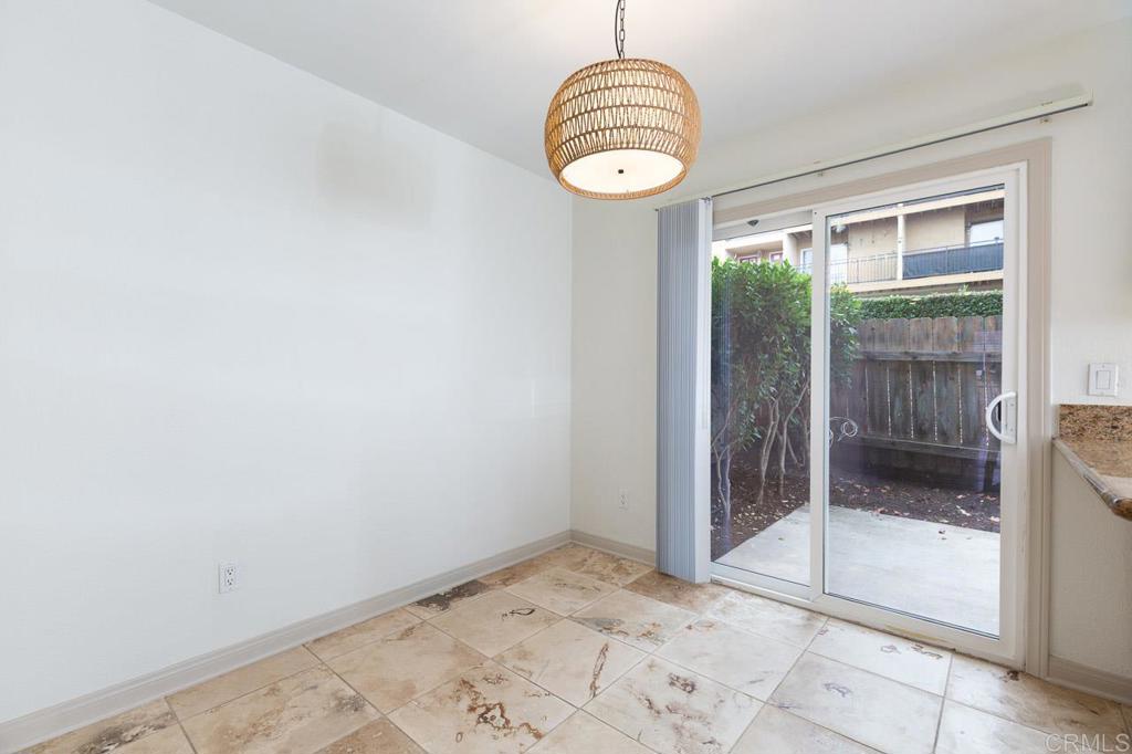 505 San Pasqual Valley Road, Unit 186 Escondido, CA 92025 - Photo 8 of 28 a view of a room with wooden floor and iron gate