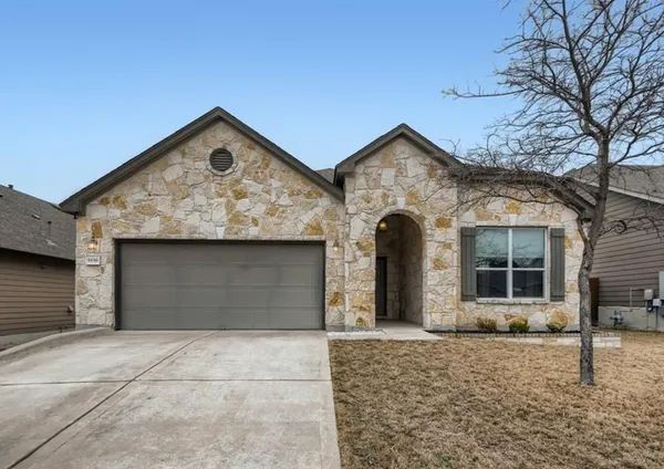 a front view of a house with garage