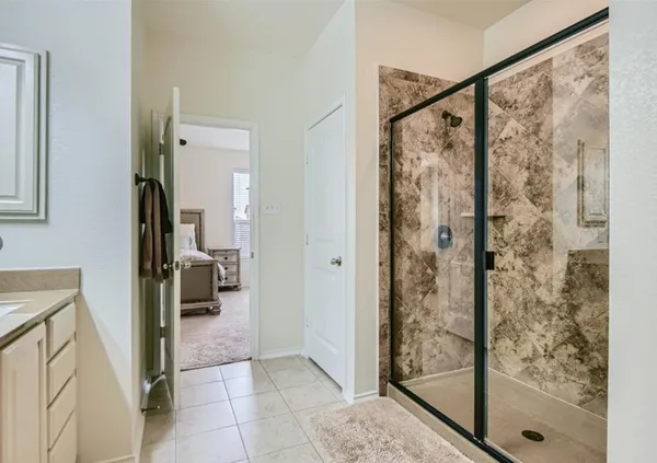 a view of a bathroom from a hallway
