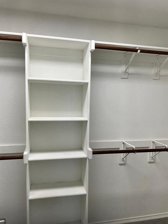 4312 Ridge Point Lane Plano, TX 75024 - Photo 6 of 16 a view of walk in closet with empty racks