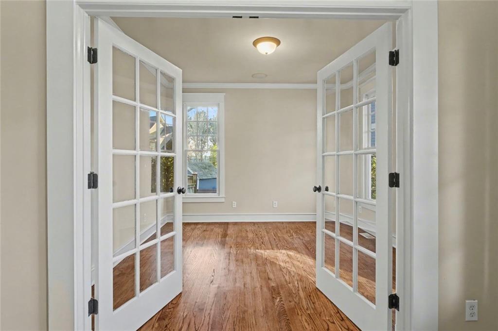 3105 Brick Lane Decatur, GA 30033 - Photo 12 of 72 a view of an empty room with wooden floor and a window